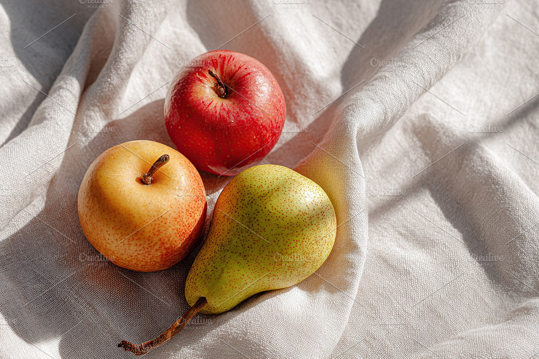 Seasonal fruits lay on a soft fabric showcasing apples and pears in natural lig, a Food & Drink Photo by AlyaAnd