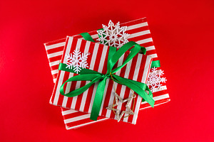 Bright high-colored background with Christmas boxes, festive bau