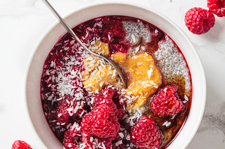 Chia pudding in bowl with raspberries, peanut butter and coconut, a Food & Drink Photo by vaaseenaa