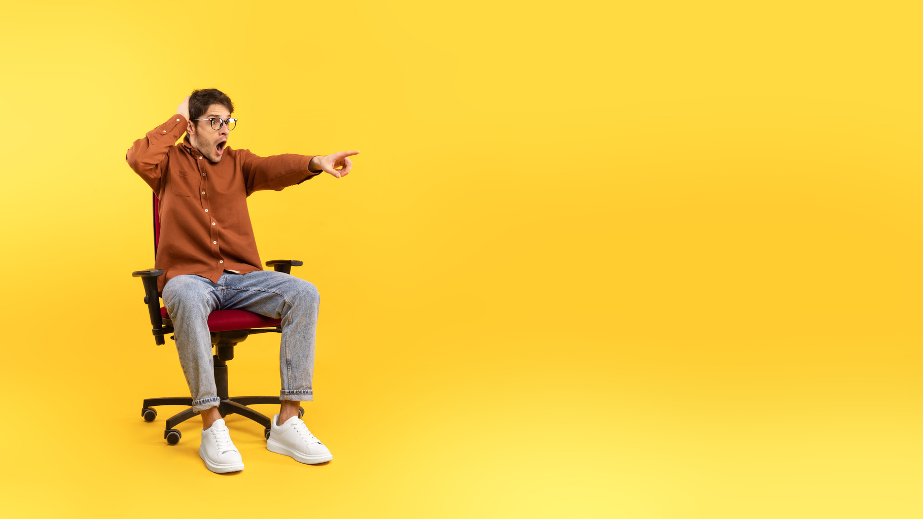 Shocked Man Pointing Finger Aside At Empty Space, Yellow Background, a ...