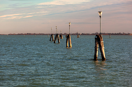 Typical wooden poles in a Venetian lagoon, an Architecture Photo by Bepslabor