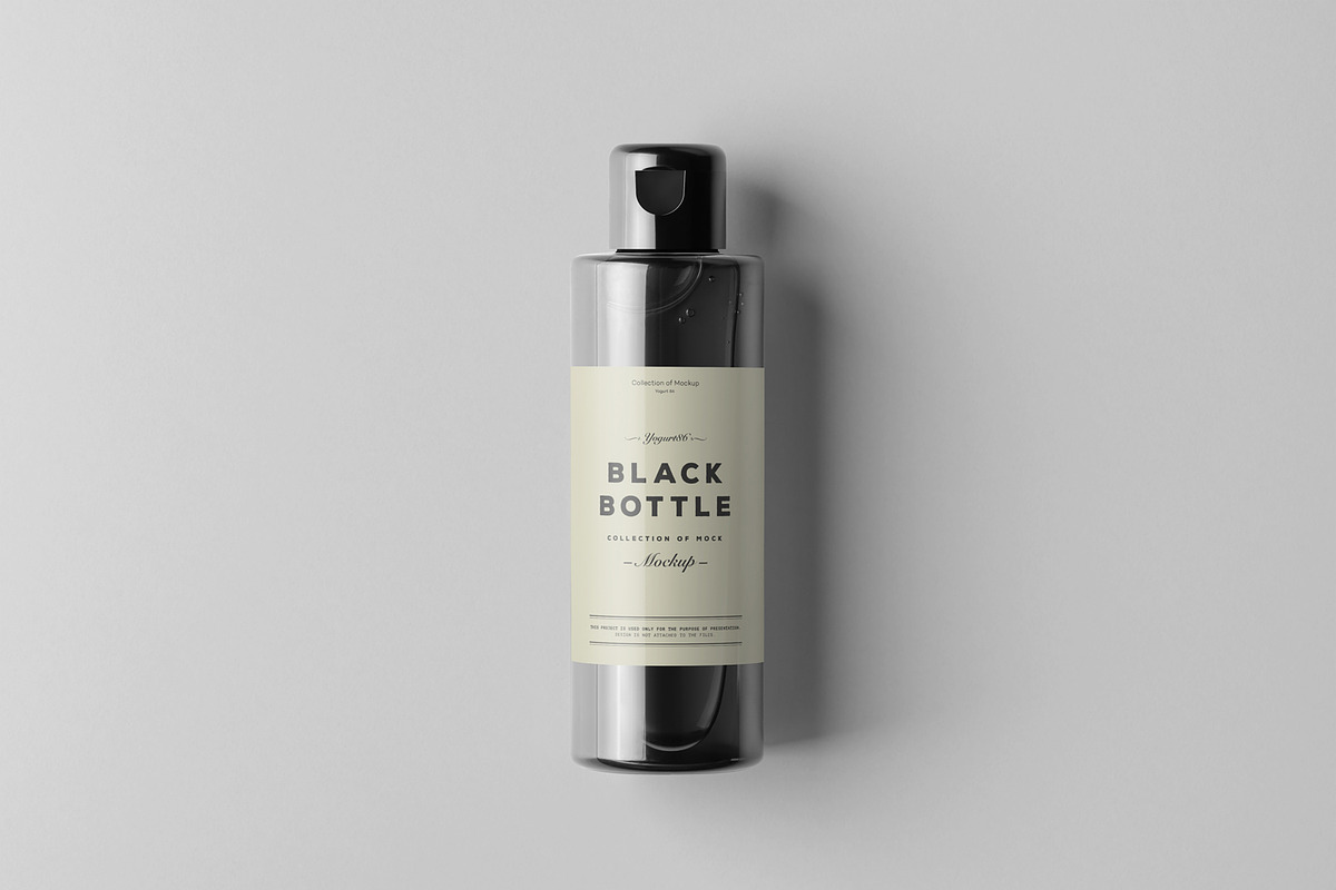 Black Bottles Cosmetic Mockup, a Cups & Container Mockup by Yogurt86 (Photo 7 of 10)
