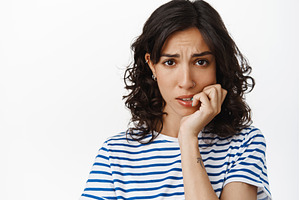 Close up of anxious brunette girl