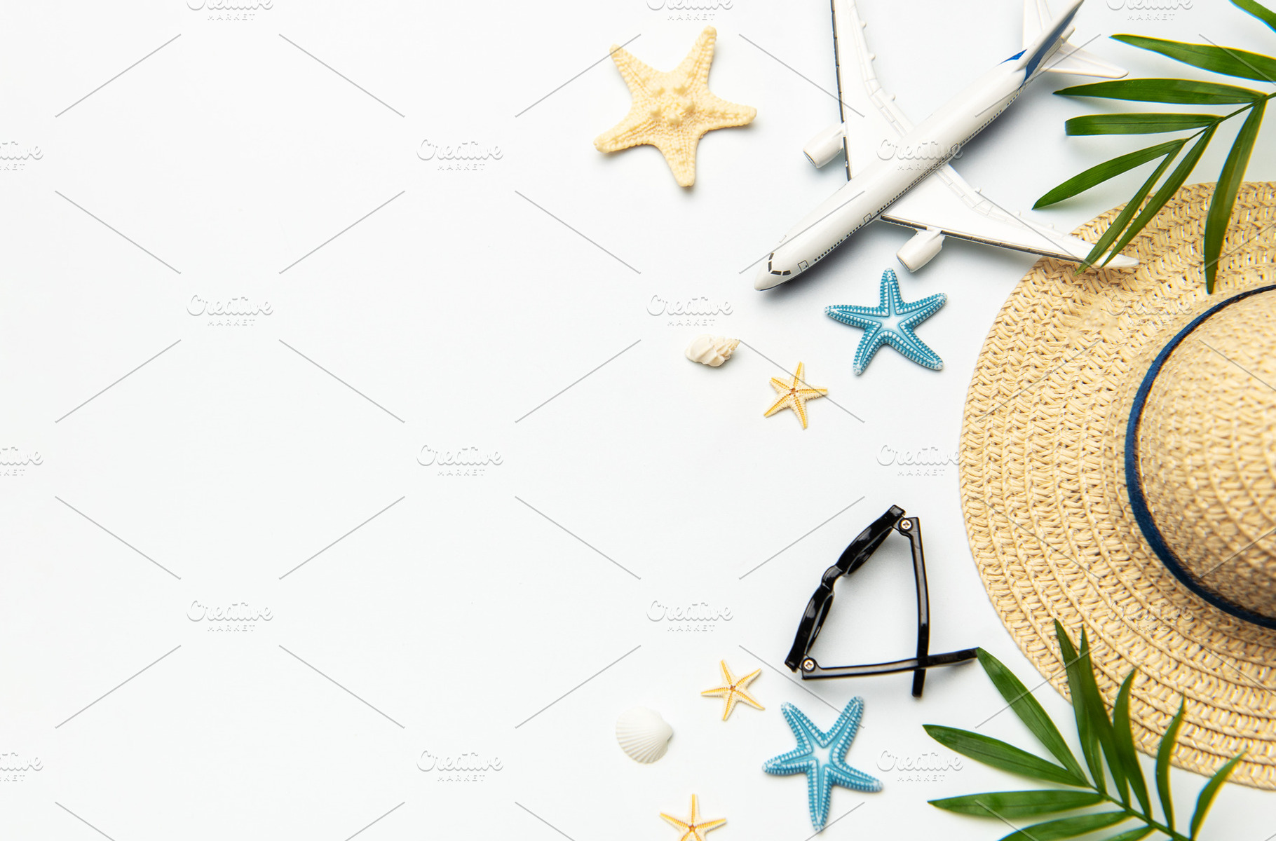 Summer vacation concept featuring airplane, sunglasses, straw ha, a Holiday Photo by Olena Rudo