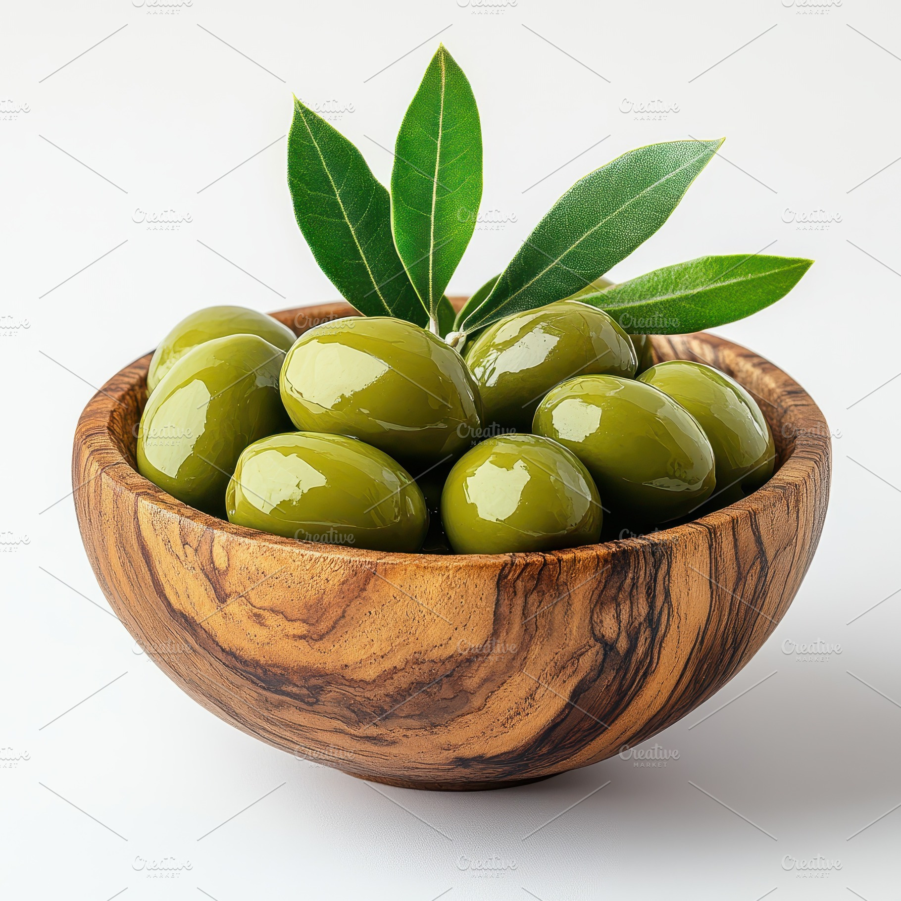 Green olives in wooden bowl with lea, a Food & Drink Photo by Pixeness Studio