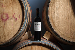 Wine Bottle on a Barrel Label Mockup