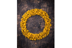 Raw pasta in shape of shells, a Food & Drink Photo by Yulia Furman