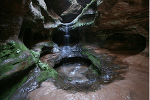 A waterfall is located in the back, a Nature Photo by ZinetroN