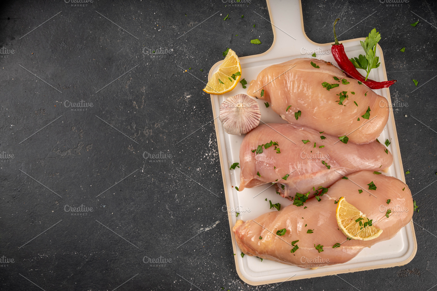 Fresh raw organic chicken breast fillet, with spices and condime, a Food & Drink Photo by Rimma