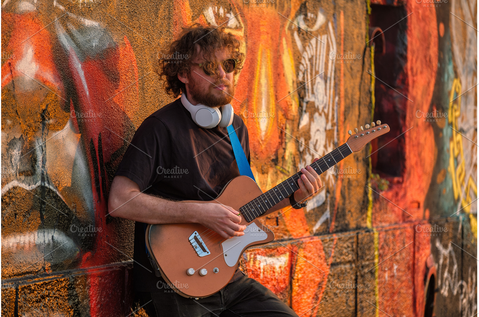 Street musician playing electric, a Person Photo by f9photos