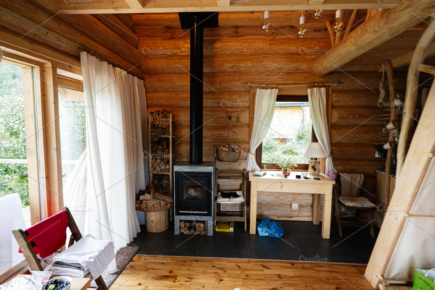 Cozy wooden cabin interior with a fireplace and rustic furniture setup, a Photo by AS photostudio