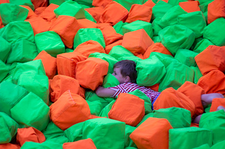 Child on soft cubic blocks