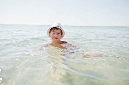 Boy wear panama hat swimming in Red sea., a Person Photo by AS photostudio