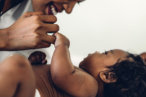 Portrait of enjoy happy love family african american mother play