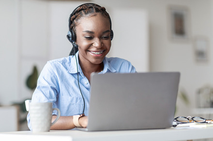 Hotline Operator. African woman call, a Photo by Prostock-Studio