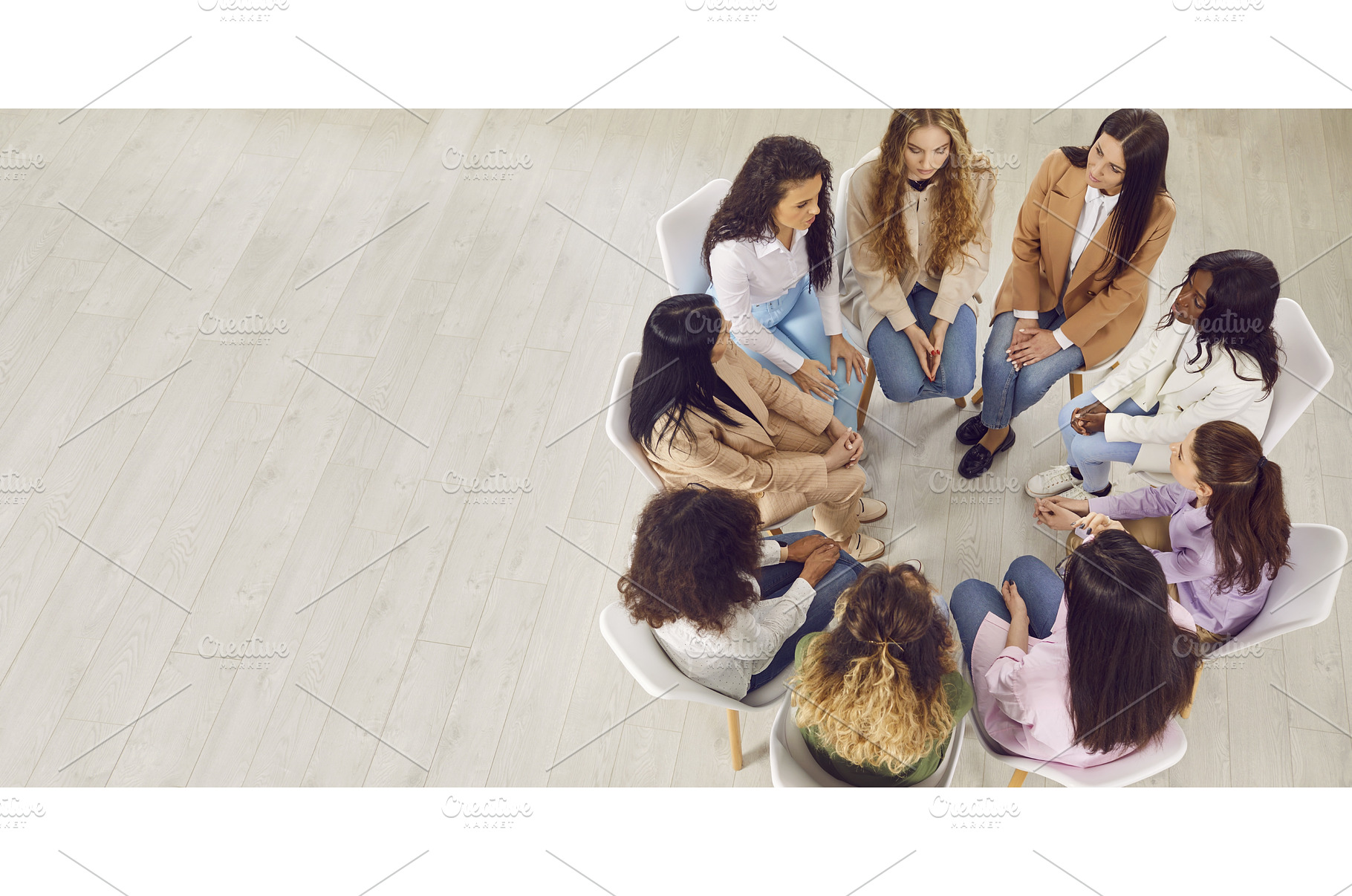 Young diverse women discussing, a Business Photo by StudioRomantic