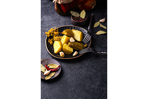 Bowl of pickled marinated cucumbers, a Food & Drink Photo by Yulia Furman
