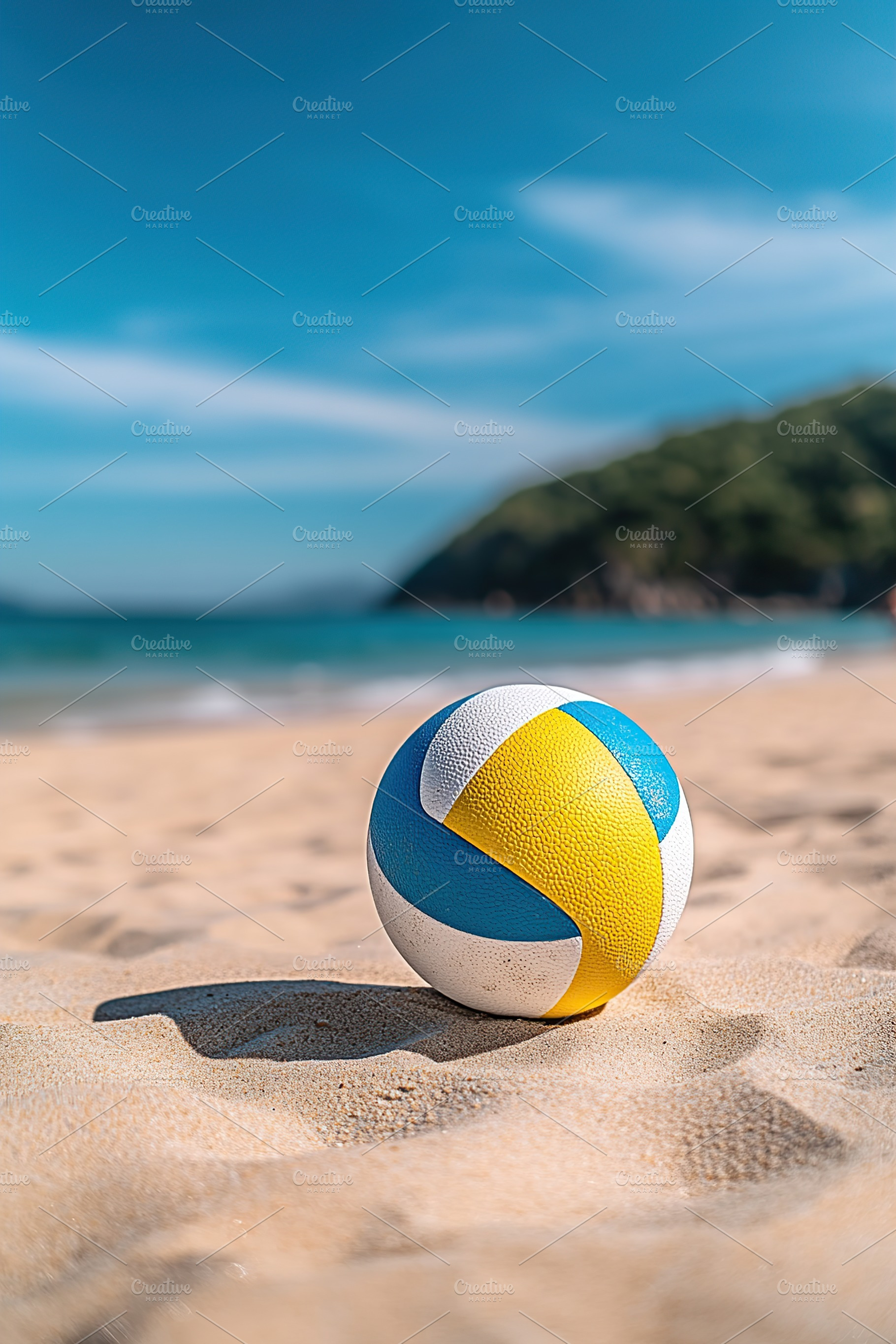 Volleyball on sandy beach with clear blue sky and gentle waves in the backgroun, a Sports & Recreation Photo by AlyaAnd