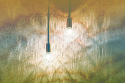 Lamps on the background of a beige wall containing bulb, lamp, and wall, an Abstract Photo by Photostock