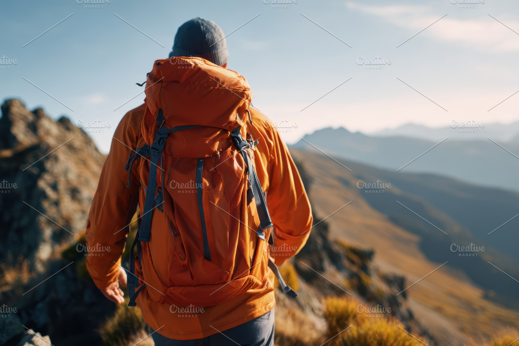 Man hiking on a mountain trail, a Person Photo by AlyaAnd