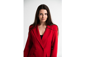 Young woman confidently posing in a, a Business Photo by volodymyrshtun13795