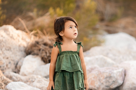 Little toddler girl in green dress