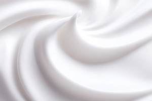 White creamy texture forming soft, smooth swirls and curves, rep, a Photo by Studio ANNA