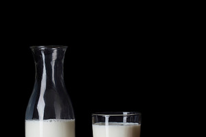 Milk bottle and milk glass stock photo containing background and beverage