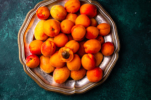 Ripe apricots on dark background, a Food & Drink Photo by Yulia Furman