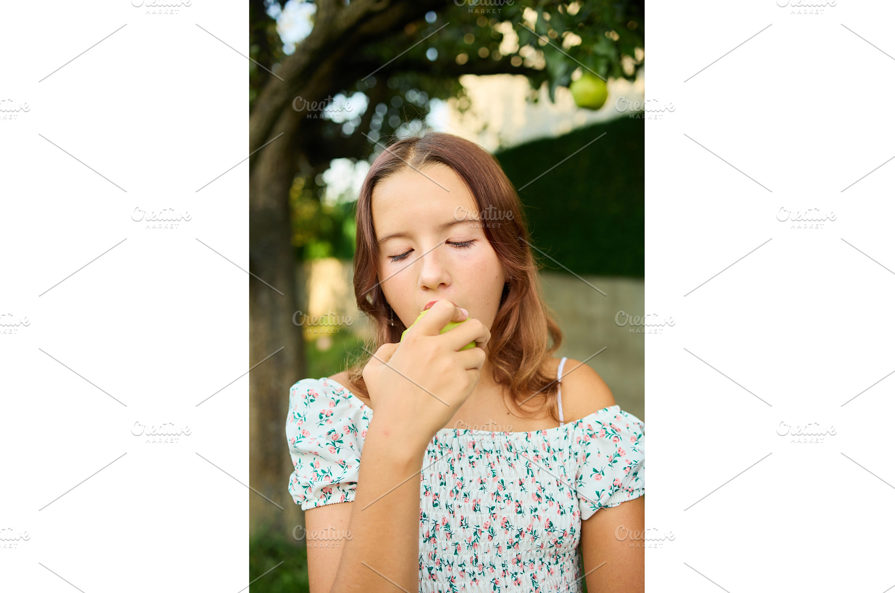 Girl eating a pear while standing in, a Nature Photo by IlliaBondarPhotography