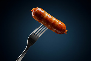 Grilled sausage on a silver fork aga, a Food & Drink Photo by professorinc