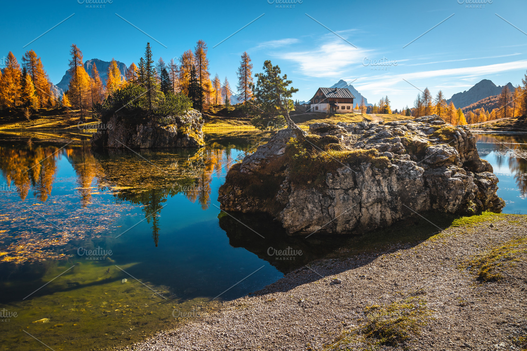 Mountain shelter on the lake shore, a Nature Photo by Alpine Dreams
