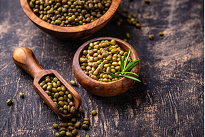 Raw uncooked mung beans on black, a Food & Drink Photo by Yulia Furman