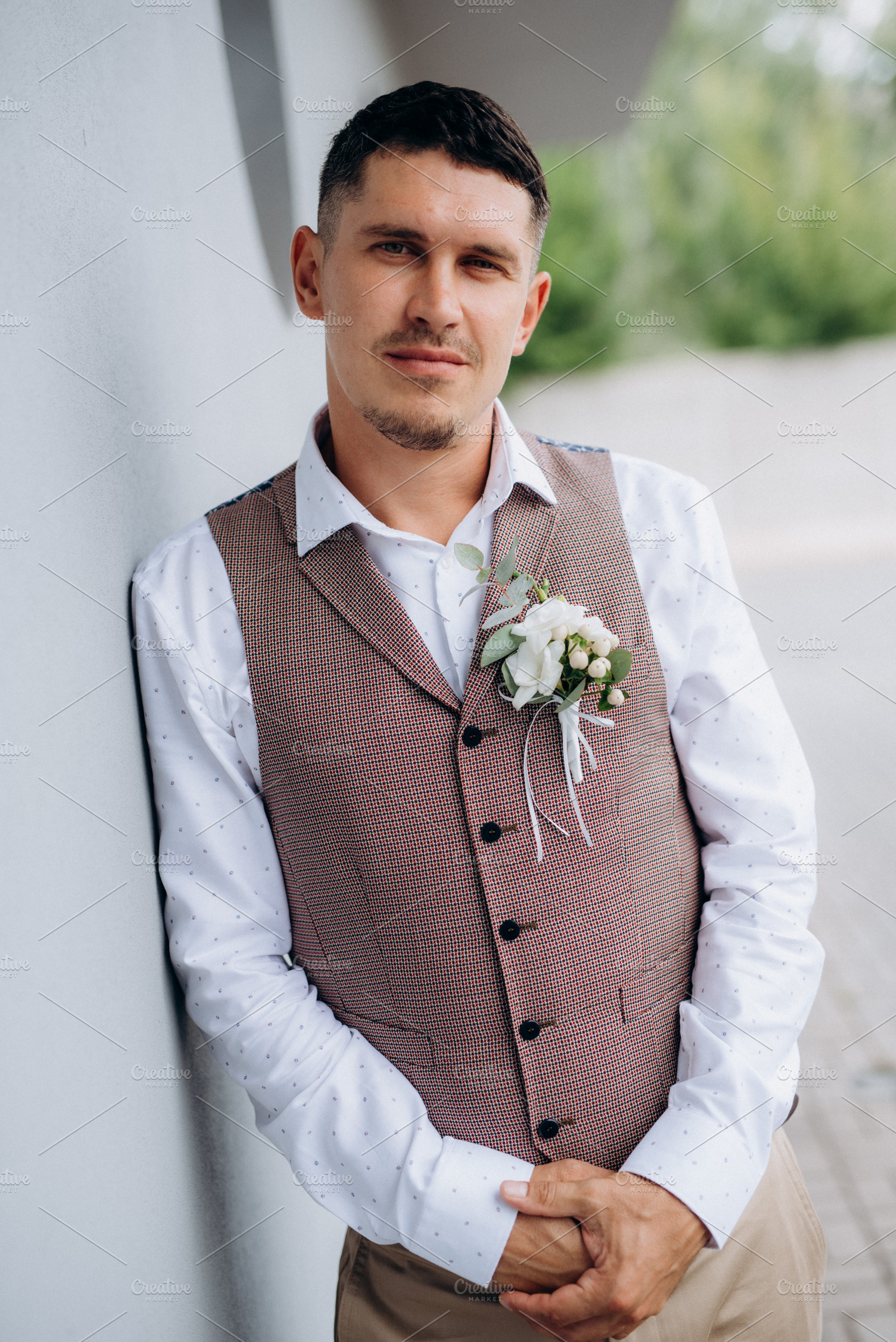 portrait of the groom in a gray suit and an orange vest, a Person Photo by Weddings, People, Travel
