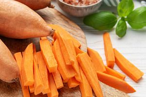 Preparing sweet potato fries on a cutting board, a Food & Drink Photo by Olena Rudo