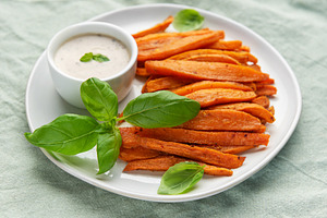 Sweet potato fries with dipping sauce and basil, a Food & Drink Photo by Olena Rudo