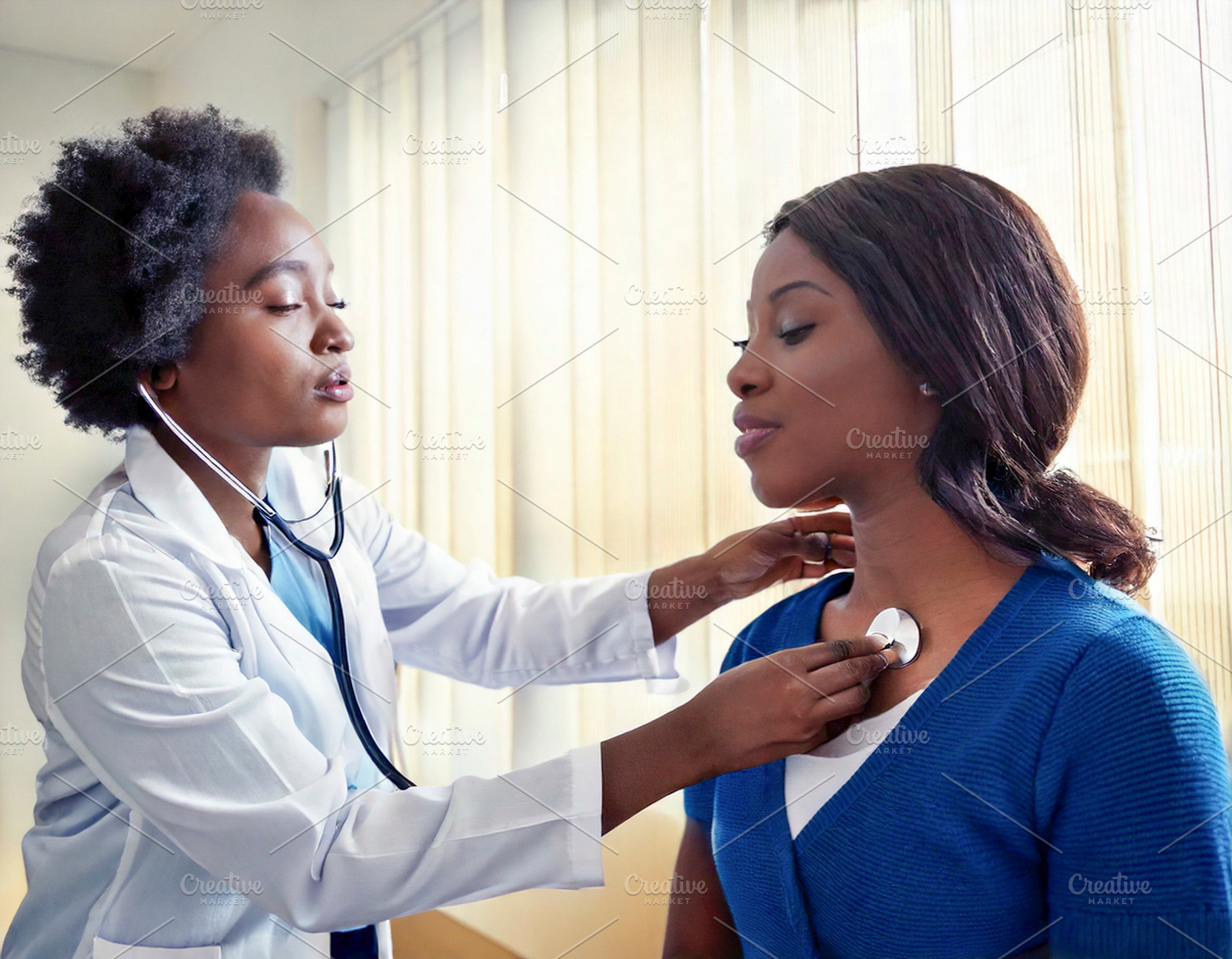 Patient being examined by a doctor using a stethoscope, a Health & Medical Photo by DanFLCreativo