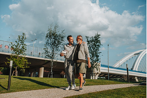 Sporty father and adult son walking, a Person Photo by HalfPoint