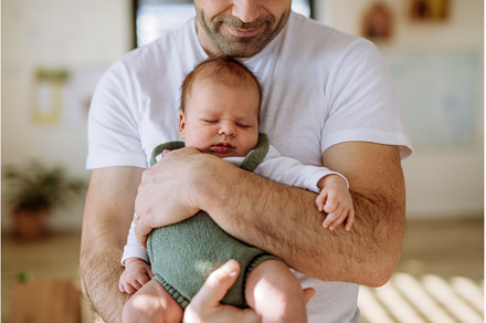 Close-up of father holding his, a Person Photo by HalfPoint