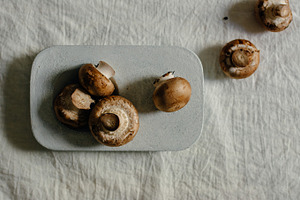 Raw mushrooms in blue stone table stock photo containing mushroom and