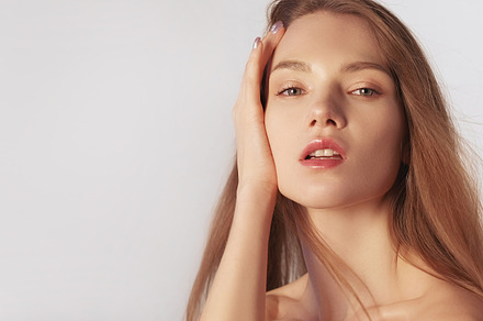 Moisturizing skincare woman hand touching face, a Beauty & Fashion Photo by Photo Drive Studio