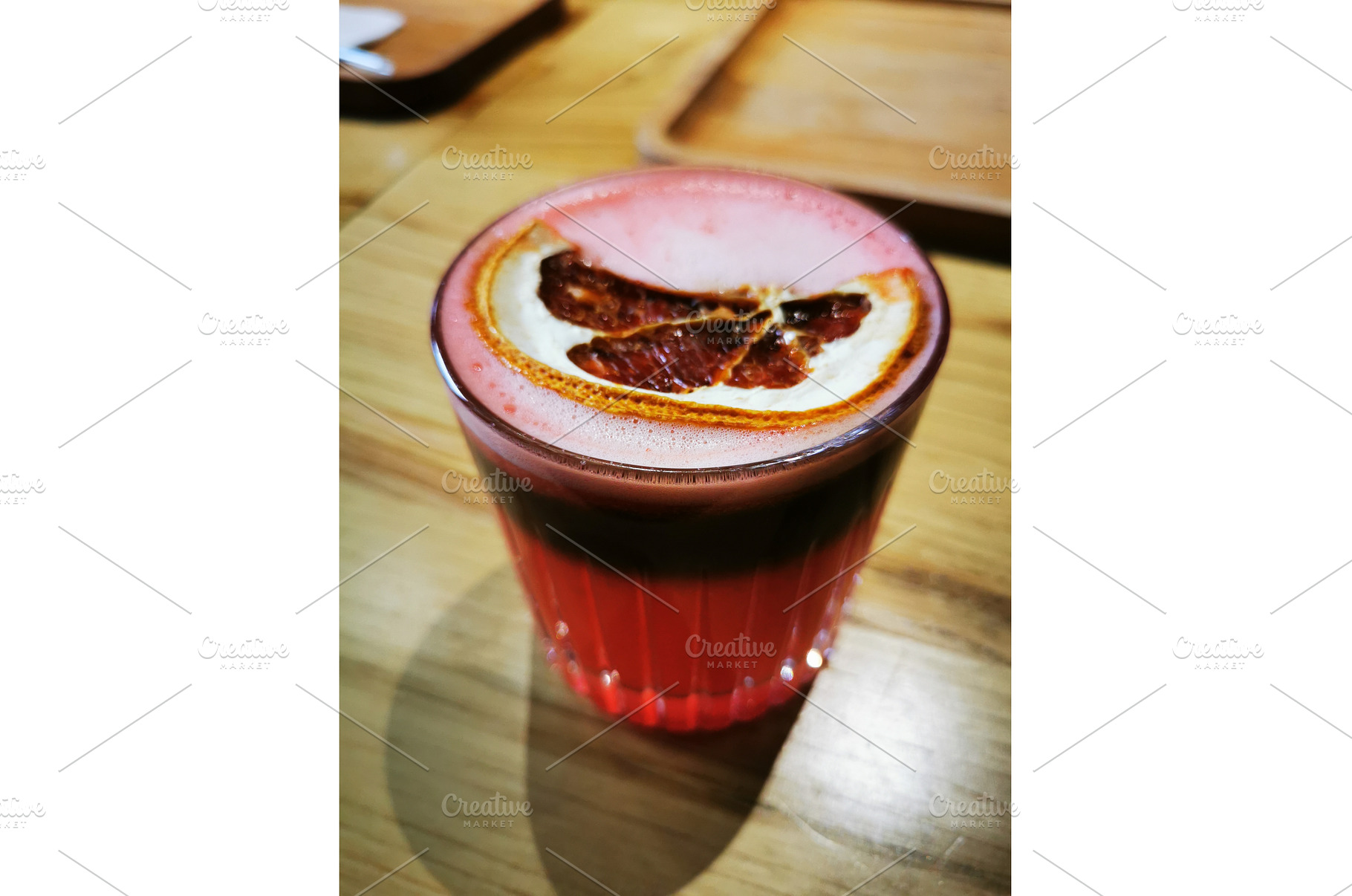 Red Bumble coffee mocktail in glass, a Food & Drink Photo by sceptical cactus
