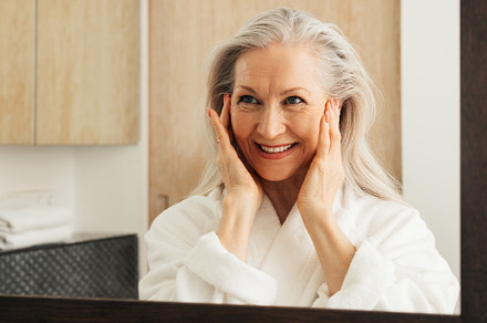 Smiling woman with grey hair, a Person Photo by Artem Varnitsin