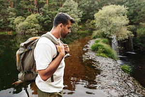 Man with backpack contemplating a st, a Sports & Recreation Photo by Perpis