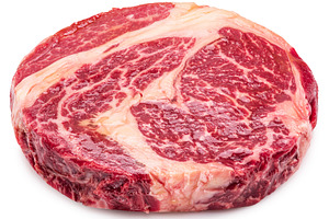 Raw ribeye steak on white background, a Food & Drink Photo by Volff