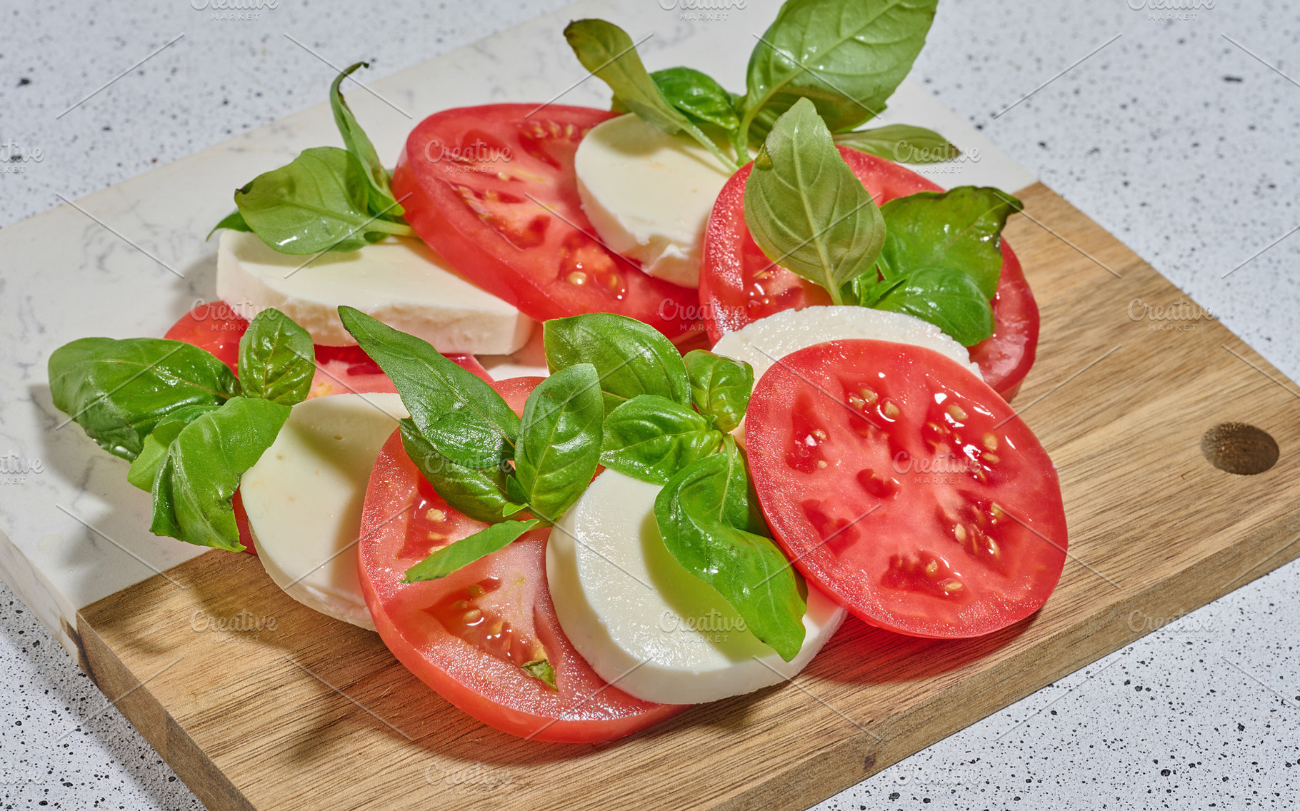 Classic Caprese salad with tomato slices, mozzarella and basil l, a Food & Drink Photo by ndanko