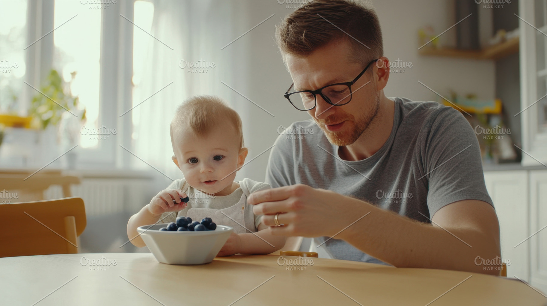 Father and baby enjoy meal together, a Photo by Beautiful things