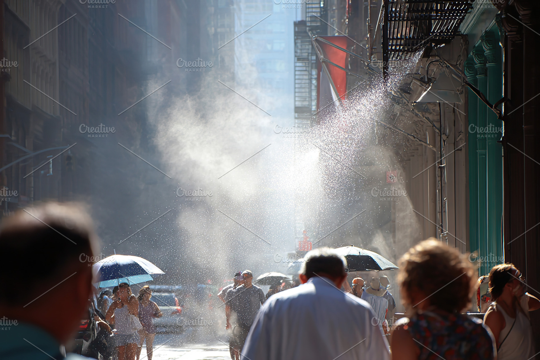 Urban street bustling with activity and heat haze on a warm day, a Photo by AlyaAnd