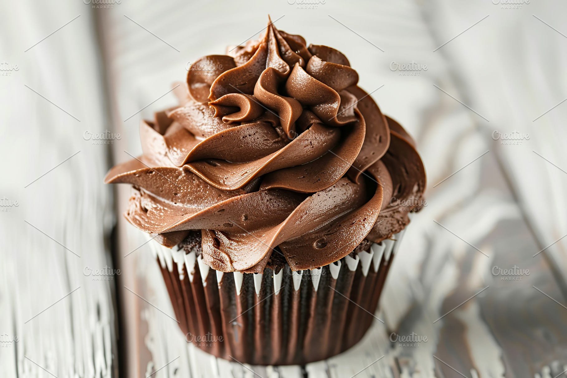 Chocolate cupcake with whipped cream on wooden table, a Food & Drink Photo by AlyaAnd