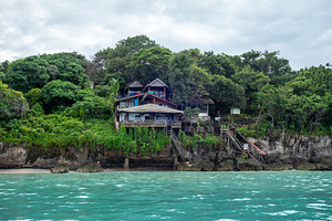 Traditional cliffside houses on Bira Beach, Sulawesi, Indonesia, a Nature Photo by GoodGoods